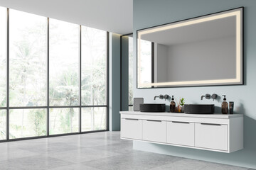 Hotel bathroom interior with double sink and accessories, panoramic window
