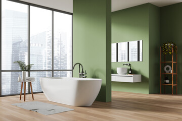 Green home bathroom interior with bathtub and sink, window and mockup wall