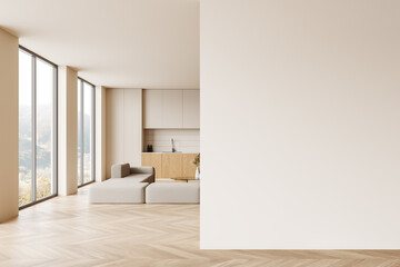 Beige home kitchen interior with cooking cabinet and sofa, window. Mockup wall