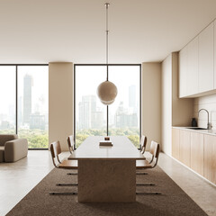 Home kitchen interior with dining table, cabinet and sofa near panoramic window
