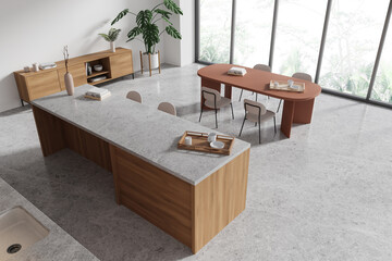Top view of home kitchen interior with bar island, cooking cabinet near window