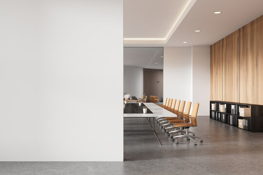 Empty office conference room with blank white wall and wooden accents. 3D Rendering - Powered by Adobe