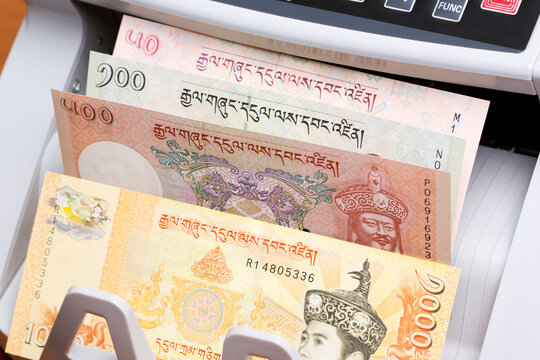 Bhutanese money - ngultrum in the counting machine