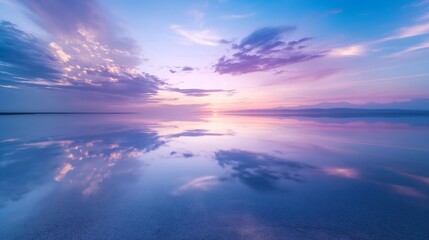 Obraz premium Salt lake at sunset lake view reflects a dramatic sky and reflect the reflection in the lake