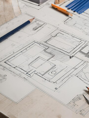 The image could be named Architect's Desk with Blueprints, Tools, and Plans for Construction and Design Projects