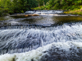Cascades on the river in summer.