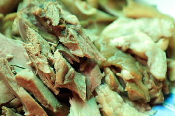 A close-up of boiled pig trotters, showcasing the texture and detail of traditional Asian cuisine, is ideal for food-related content and culinary presentations.