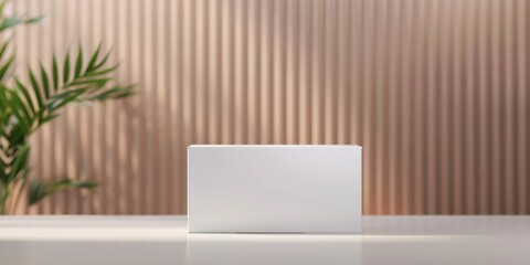 A minimalist white box sits elegantly on a table, surrounded by subtle decor, perfect for product presentations or branding.