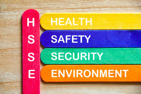 HSSE white text representing health, safety, security and environment on multicolored wooden sticks. Safety concept