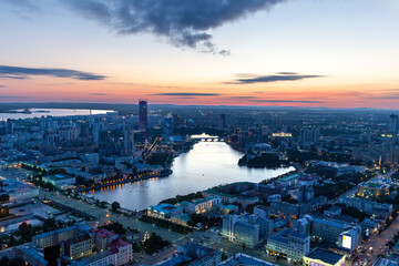 Obraz premium Evening panorama of the modern city of Yekaterinburg on the banks of the Iset river