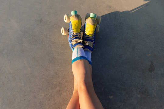 Close-up view of a girl roller skating in a park