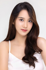 Naklejka premium Beautiful young Asian woman with natural beauty make up style shows healthy and perfect skin on isolated background. Facial and skin care concept for commercial advertising.
