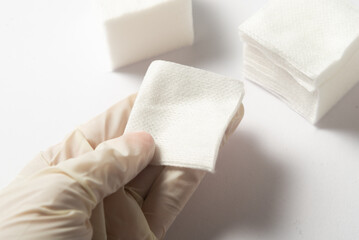 Lot of sterile cleansing swabs, nonwoven swab in hand in glowes