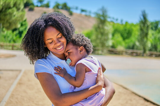 African American mother and daughter sharing a loving embrace