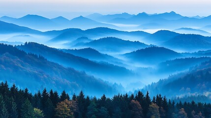 Obraz premium Misty mountain landscape with a blue hue.