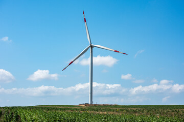 Wind Turbine with blue sky background. Renewable energy concept.