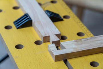 Senior man Cutting Dovetails With Woodworking Hand Tool for Hobby After retirement.