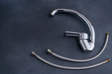 Hoses for water mixer. Chrome-plated mixer tap for water in the bathroom and kitchen. Plumbing...
