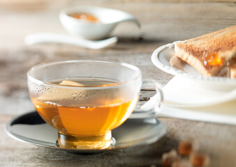 Cozy Morning Tea with Toast and Jam on Rustic Table
