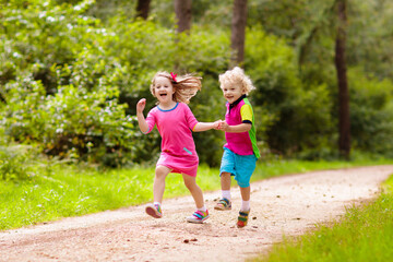 Fototapeta premium Kids play in autumn park