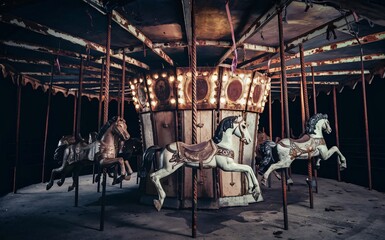Creepy Carousel A rusted, broken-down carousel with missing horses and eerie shadows cast by the moonlight, Halloween