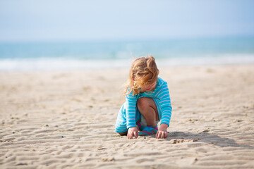 Kids playing on beach. Children play at sea.