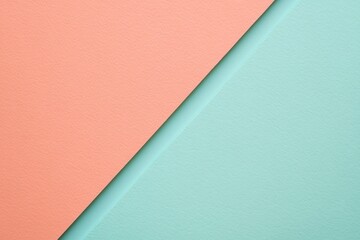 Pastel color paper texture with peach mint diagonal split
