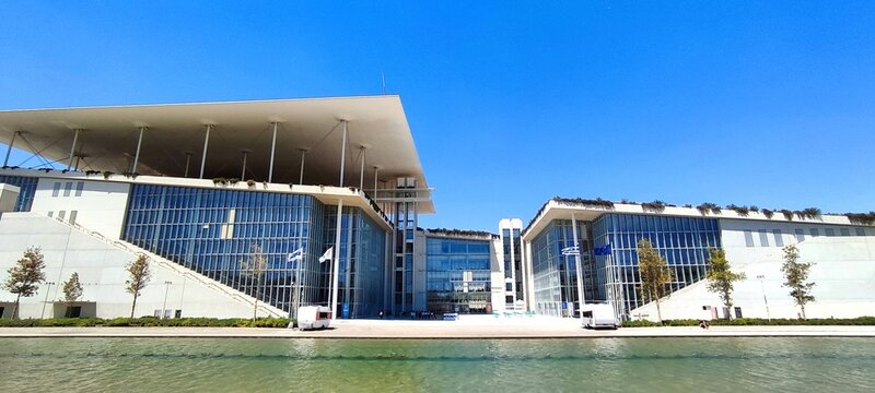 Exterior view of the Stavros Niarchos Foundation Cultural Center, located in Kallithea, it features the Greek National Opera, the National Library, and a large park.