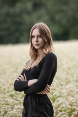 Portrait of a young beautiful long-haired girl in nature.