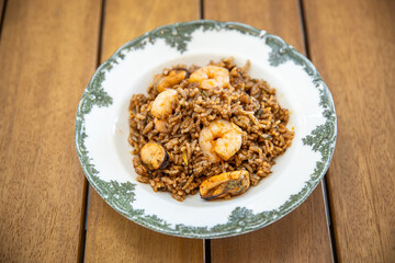 Rice with mussels and shrimp on a plate