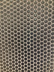 Black round glazed mosaic tiles with cement grout. Penny round tiles