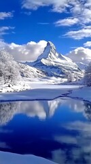 Serene Mountain Majesty: Pristine Lake Reflecting Snow-Capped Peaks in Winter Wonderland. Inviting Tranquil Escape and Outdoor Adventure Amidst Nature's Grandeur. Perfect for Travel, Holiday Getaways,