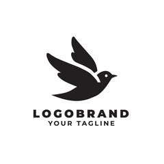 Obraz premium A black and white bird logo with the words logo brand and your tagline. The bird is flying and has a white outline