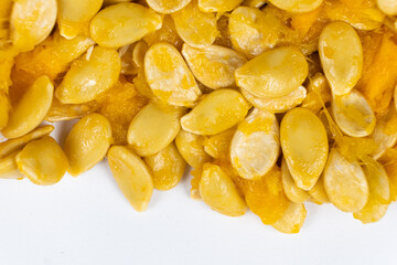 Raw seeds from fresh hokkaido pumpkin on a white background