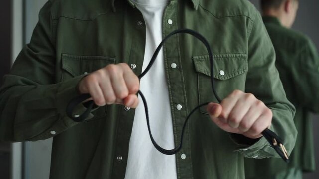 A man without a face whips a belt.
The belt is in the hands of an evil man.
Conflict situation.
Household problems