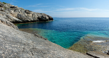 Amazing rocky formations and gorgeous sea waters of the south coastline in Othonoi island, Greece