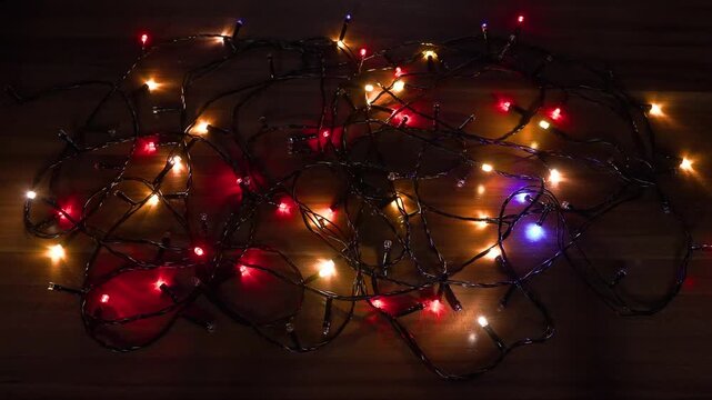 Christmas tree garland. Yellow, green, red and green lights. Seamless looping