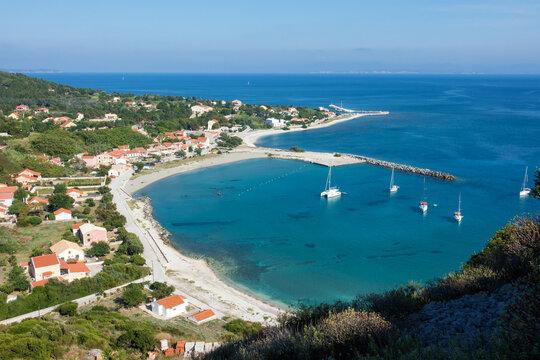 Amazing view down to the sea and the harbor village from the mountain in Othonoi island, Greece