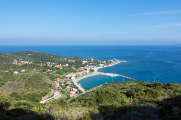 Amazing view down to the sea and the harbor village from the mountain in Othonoi island, Greece