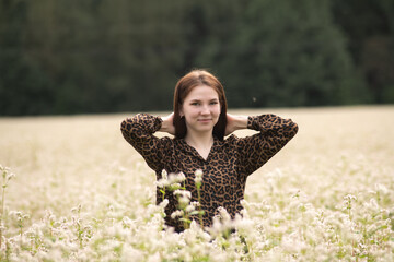 Portrait of a young beautiful long-haired girl in nature.
