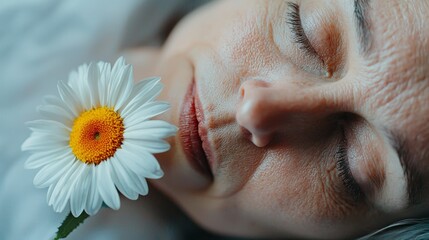 Naklejka premium a woman laying down with flower in her mouth