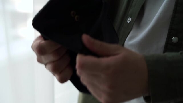 A man holds a wallet without money.
Poverty, finance, money