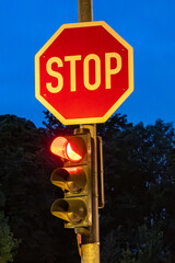 Road junction with traffic lights and stop sign