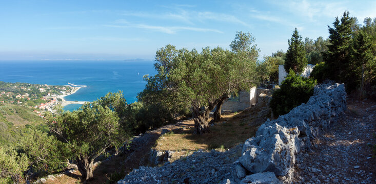 Amazing view down to the sea and the harbor village from the mountain in Othonoi island, Greece