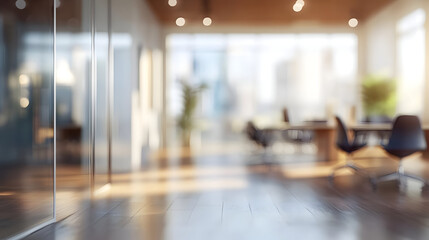 Blurred view of a modern office space with wood floor.