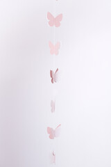 Hanging garland with soft pink butterflies