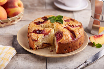 Sponge cake with peaches and brown sugar. Delicious homemade sweet pie with seasonal fruits. 