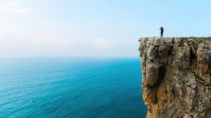 Capturing Adventure from Above: Aerial View of Photographer on Cliff with Breathtaking Landscape Below