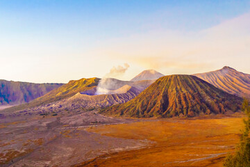 Dramatic sunrise over Mount Bromo, showcasing its volcanic cone.