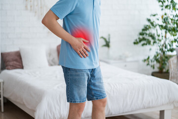Inflammation of appendicitis, stomach ulcer, bloating, man with abdominal pain suffering at home,...